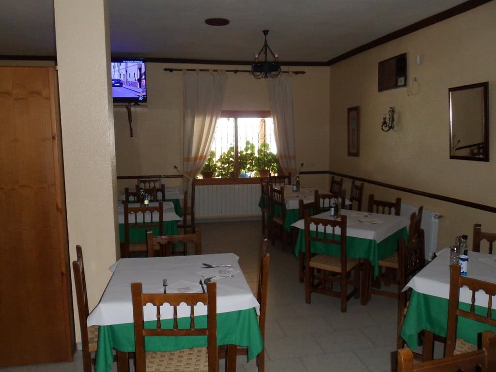 Commercial property interior in Baza, Granada with dining area and traditional decor.