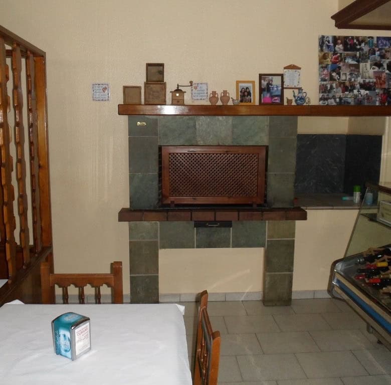 Indoor fireplace with decorative mantel in commercial property, Baza, Granada.