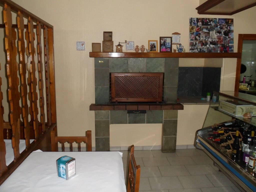Indoor fireplace with decorative mantel in commercial property, Baza, Granada.