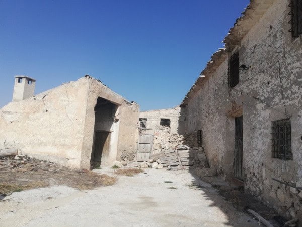 Charming farm property in Orce, Granada, featuring rustic stone buildings and scenic rural surroundi.