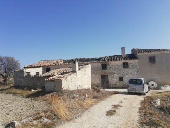 Farm property in Orce, Granada with rustic buildings and scenic surroundings.