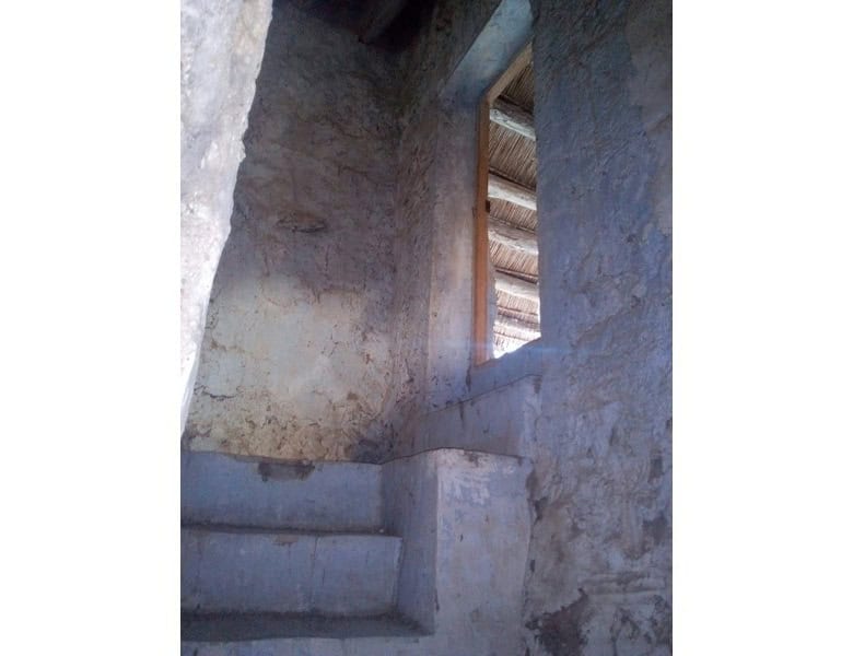 Traditional village house in Bayarque, Almeria, with rustic stone walls and a small window.