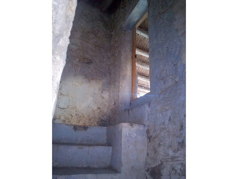 Traditional village house in Bayarque, Almeria, with rustic stone walls and a small window.