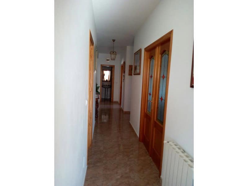 Charming village property in Hijate, Almeria, featuring traditional wooden doors and a cozy hallway.