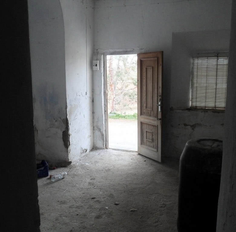 Cave house interior in Baza, Granada, showcasing rustic charm and traditional architecture.