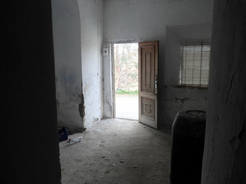 Cave house interior in Baza, Granada, showcasing rustic charm and traditional architecture.