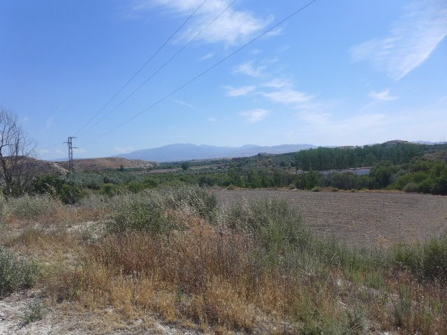 Cave House in Baza, Granada with scenic mountain views and open landscape.
