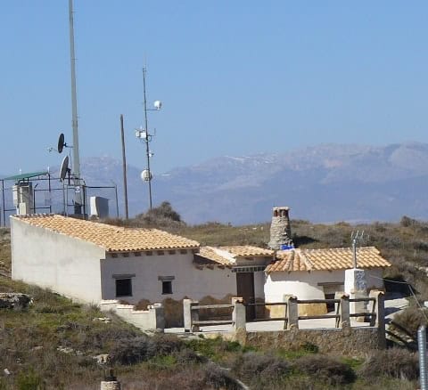 Cave house in Orce, Granada with scenic mountain views and rustic architecture.