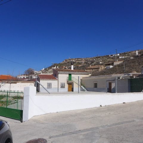 Cave house in Orce, Granada with traditional architecture and scenic hillside views. Perfect for uni.