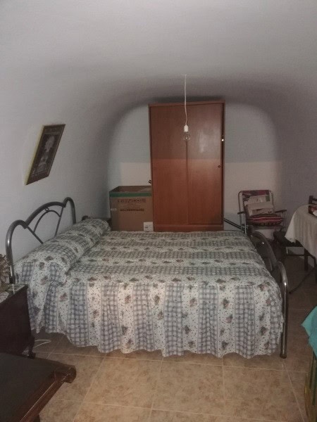 Cave house in Orce, Granada with rustic interior and unique underground architecture.