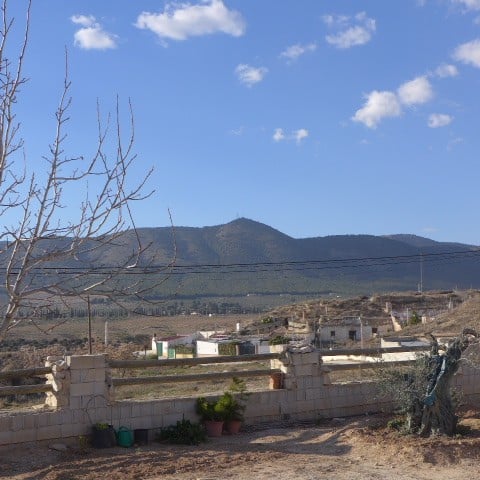 Unique cave house for sale in Huescar, Granada, with scenic mountain views.