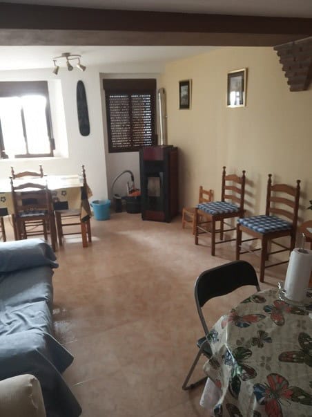 Village Property in Gor, Granada with traditional interior and inviting living space.