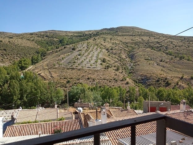 Rural property in Gor, Granada with scenic mountain views and terraced land for cultivation or devel.