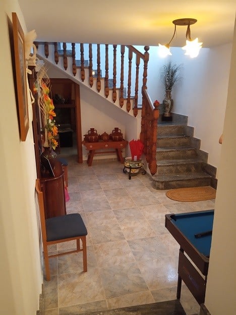 Charming rural property entrance in Gor, Granada with staircase and cozy interior details.