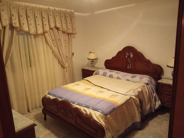 Beautiful rural property in Gor, Granada, featuring a cozy bedroom with elegant wooden furniture and.