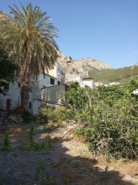 Rural property in Belerda, Jaen featuring traditional architecture and lush greenery.