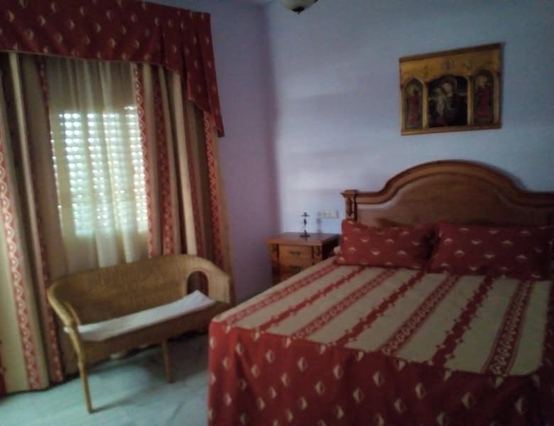 Charming village home in Somontin, Almeria, with cozy bedroom and traditional decor. Perfect for a p.