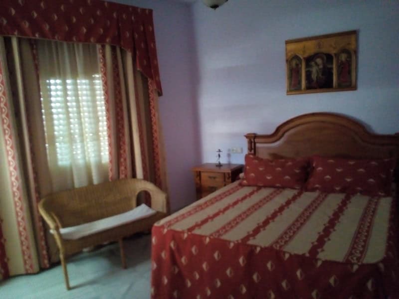 Charming village home in Somontin, Almeria, with cozy bedroom and traditional decor. Perfect for a p.