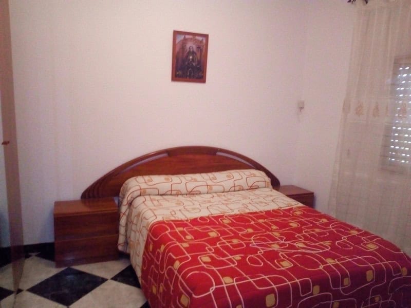 Cozy bedroom in a village property in Somontin, Almeria, featuring traditional decor and natural lig.