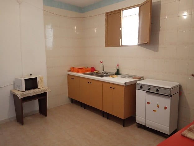 Charming kitchen in rural Gor, Granada with basic appliances and natural light. Ideal for a peaceful.
