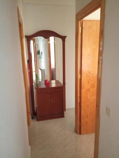 Apartment in Gor, Granada with a welcoming entrance and wooden door frames.