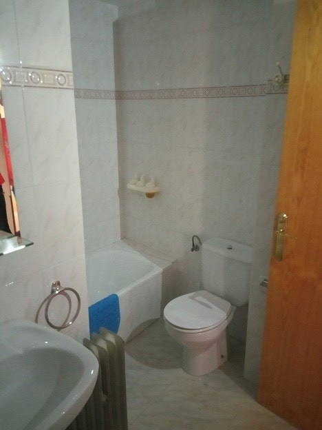 Bathroom with bathtub, toilet, and sink in Gor, Granada.