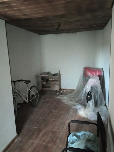 Village property interior with bicycle and furniture in Gor, Granada.