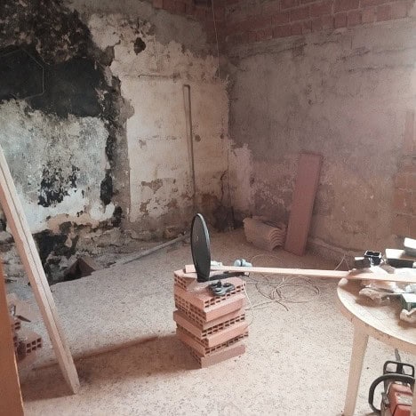 Charming village property in Gor, Granada, under renovation with exposed brick walls and constructio.