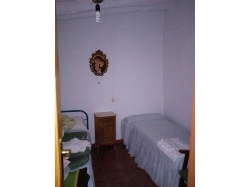 Charming village home interior in Armuna, Almeria, featuring simple furnishings and traditional deco.