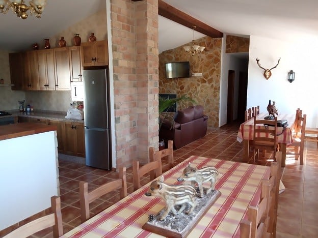 Charming country estate in Fontanar, Jaen with rustic interior, wooden furniture, and scenic decor.