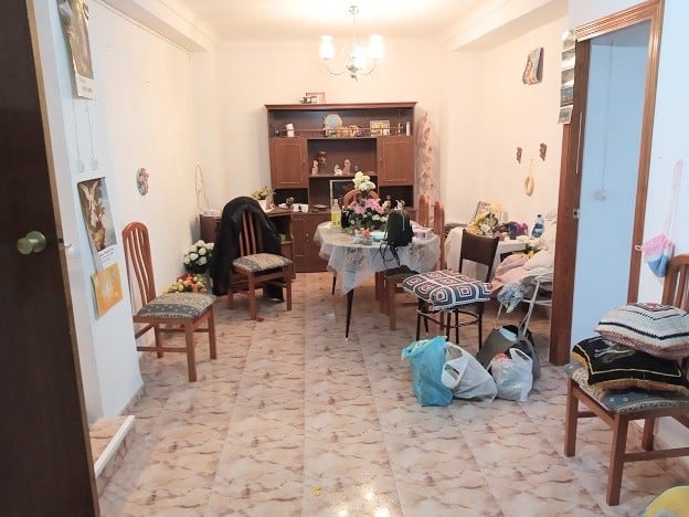 Interior view of a village property in Hinojares, Jaen with simple furnishings and decor.