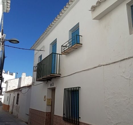 Charming village house in Hinojares, Jaen with balconies and traditional white exterior. Perfect for.