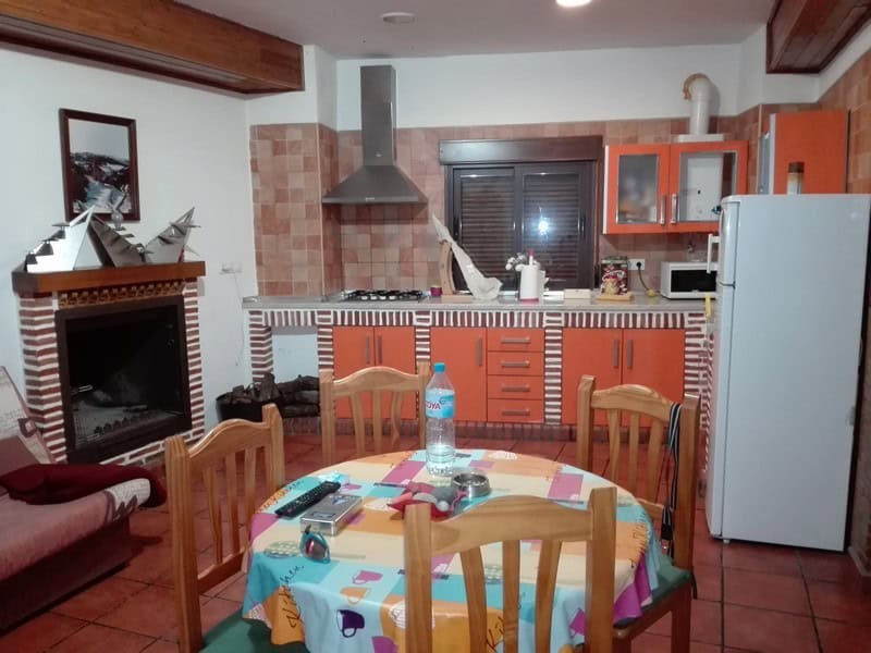 Commercial kitchen in Seron, Almeria with modern appliances and cozy dining area.