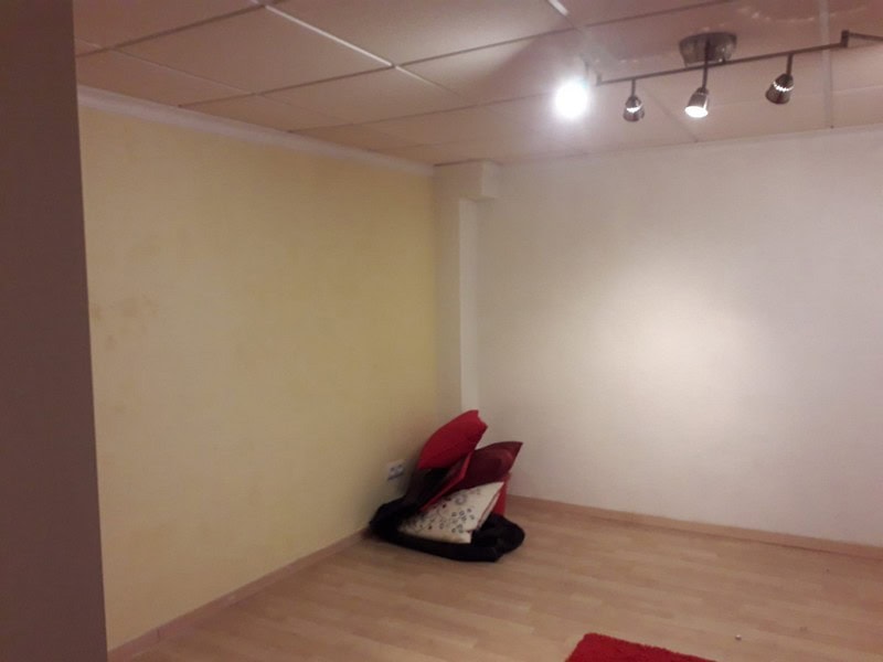 Town house interior in Seron, Almeria with minimal furnishings and modern lighting.