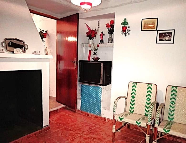 Charming village home interior with floral decor and traditional furniture in Somontin, Almeria.