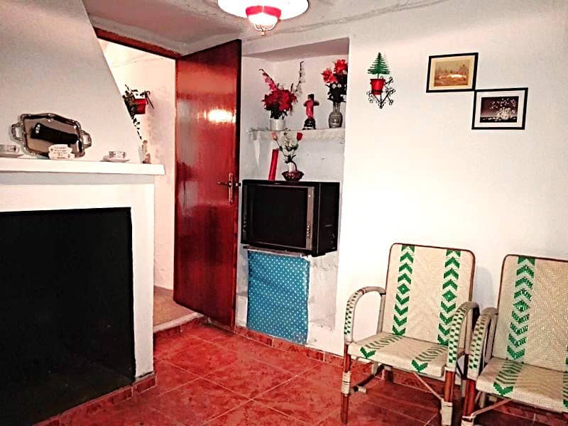 Charming village home interior with floral decor and traditional furniture in Somontin, Almeria.