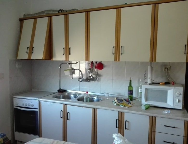 Charming kitchen in a village property in Seron, Almeria, featuring basic appliances and ample stora.