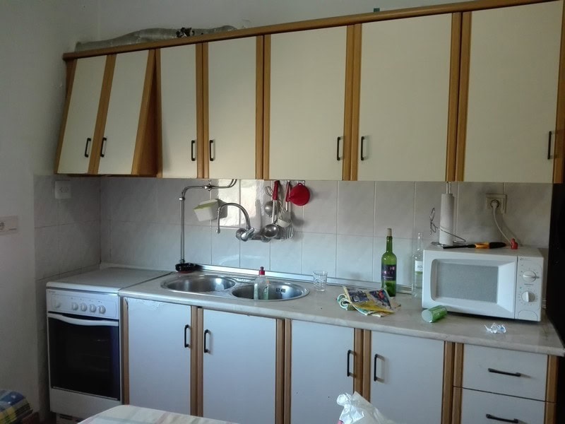Charming kitchen in a village property in Seron, Almeria, featuring basic appliances and ample stora.