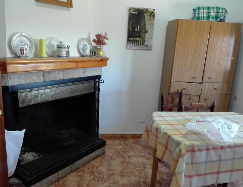 Charming village property in Seron, Almeria, featuring a warm interior with a fireplace, wooden furn.