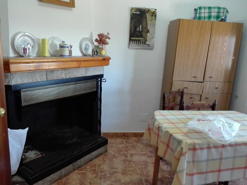 Charming village property in Seron, Almeria, featuring a warm interior with a fireplace, wooden furn.