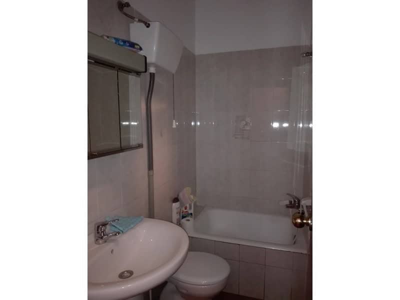 Cozy bathroom with bathtub, sink, and toilet in a traditional village property in Seron, Almeria.
