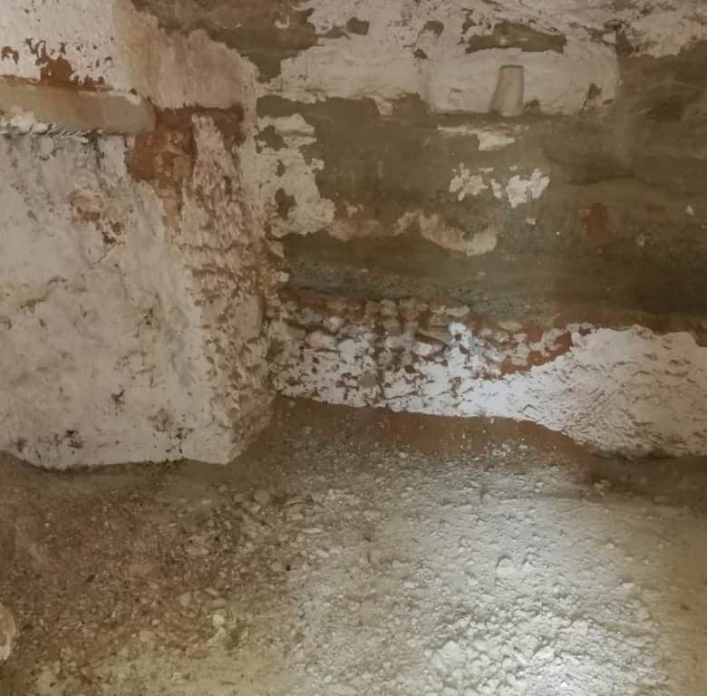 Cave house interior with rustic stone walls in Baza, Granada, ideal for renovation or conversion pro.