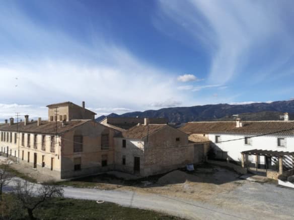 Village property in Campo Camara, Granada with traditional architecture and scenic mountain views.