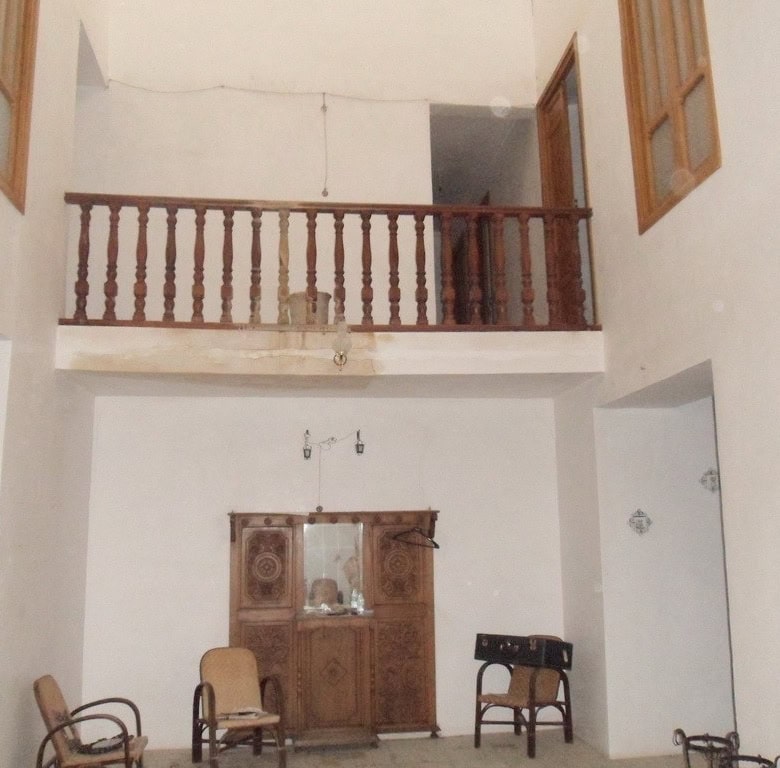 Village property interior with traditional wooden furniture in Campo Camara, Granada.