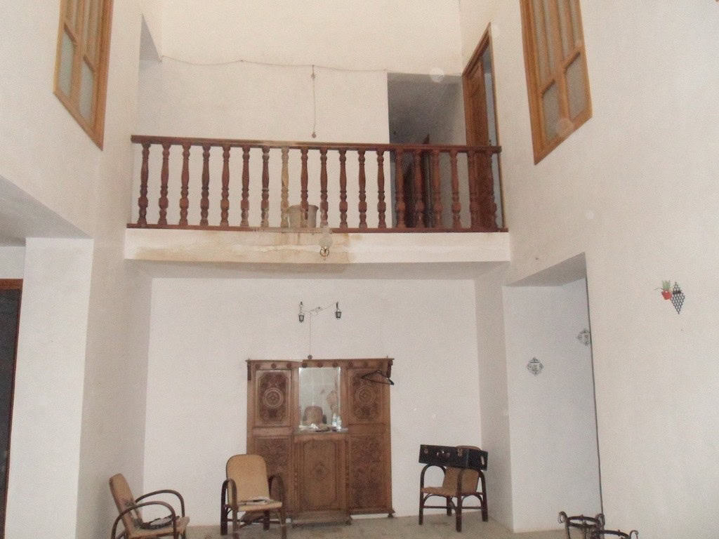Village property interior with traditional wooden furniture in Campo Camara, Granada.