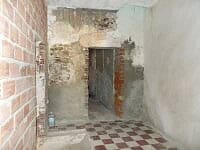 Interior view of a rustic village property in Seron, Almeria, showing unfinished walls and flooring.