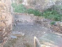 Ruins of a village property in Seron, Almeria, with stone walls and overgrown vegetation.