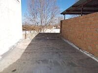 Driveway of village property in Seron, Almeria, featuring brick walls and outdoor space.