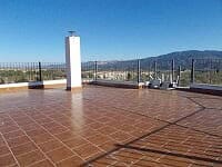Beautiful rooftop terrace with panoramic views of Lucar and surrounding mountains in Almeria.