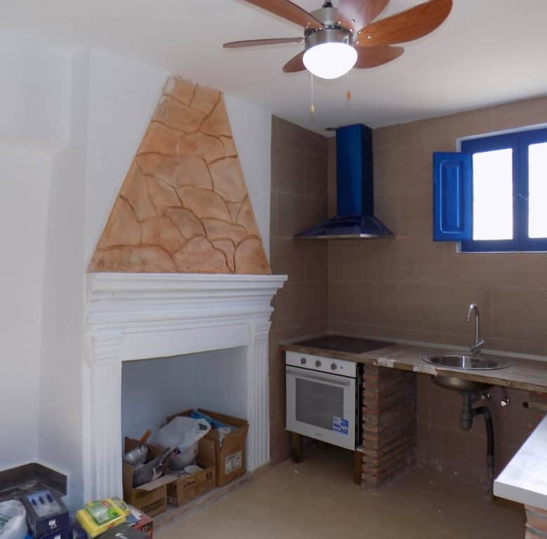 Cozy kitchen in village property, Sierro, Almeria with rustic features and modern appliances.